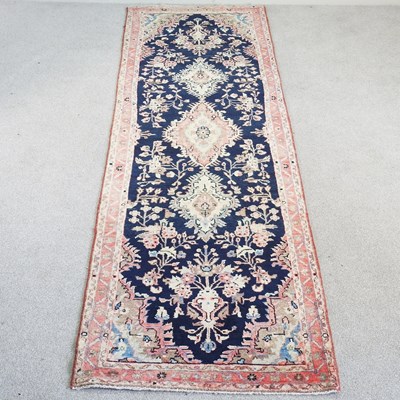 Lot 367 - A Persian mahal runner, with scrolling foliate...