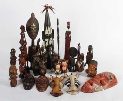 Lot 467 - A collection of African tribal carvings, some...