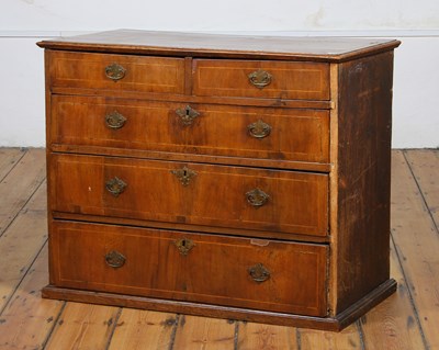 Lot 559 - A Georgian walnut chest of drawers