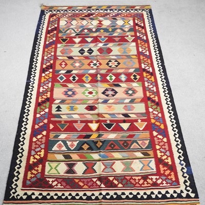 Lot 277 - A Persian Qashgai kilim, on a colourful...