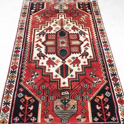 Lot 389 - A Persian Lori rug, the central medallion on a...