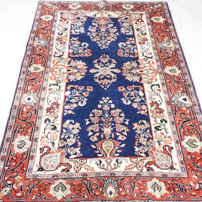 Lot 613 - A Persian Mahal rug, on a blue ground within...