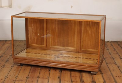 Lot 230 - An Art Deco light oak shop display counter or...