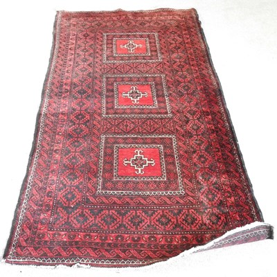 Lot 544 - A Persian rug, with three central squares, on...