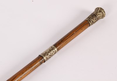 Lot 395 - A bamboo swagger stick with white metal collar...