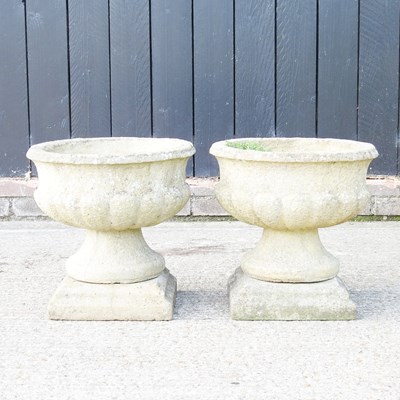 Lot 124 - A pair of cast stone garden pots, 41cm high (2)
