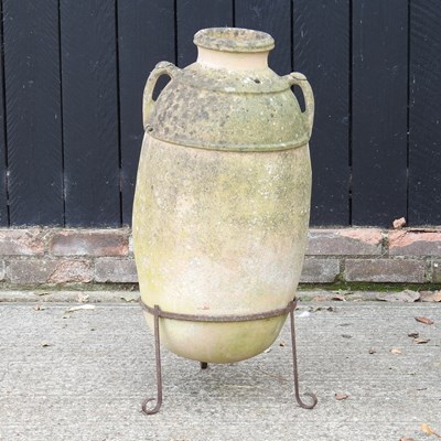 Lot 55 - A terracotta amphora olive pot, on a metal...