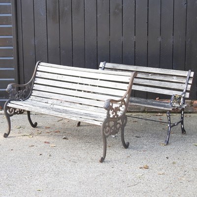 Lot 121 - A slatted garden bench with metal ends,...