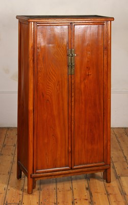 Lot 296 - A Chinese elm hall cupboard