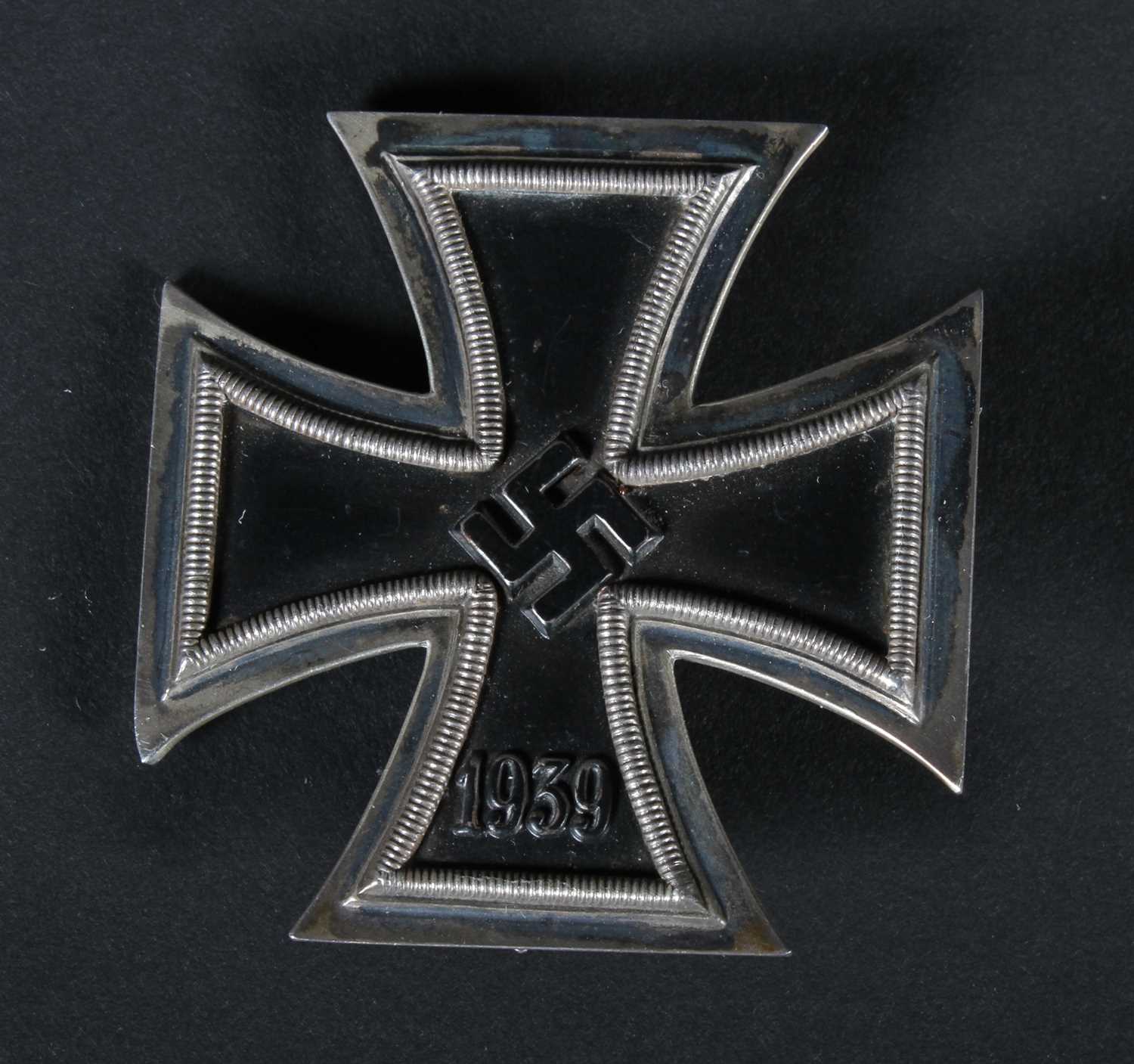 Lot 68 - A German 1939 Iron Cross medal, on a white...