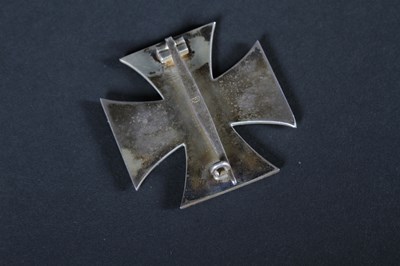 Lot 68 - A German 1939 Iron Cross medal, on a white...