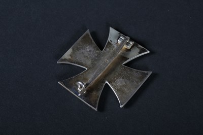 Lot 68 - A German 1939 Iron Cross medal, on a white...