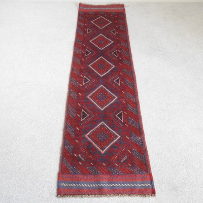 Lot 174 - A Persian runner, with five central medallions,...