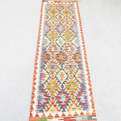 Lot 299 - A Persian kilim runner, with all over coloured...
