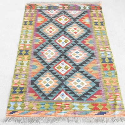 Lot 267 - A Persian kilim rug, with coloured diamonds,...