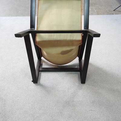 Lot 17 - A Nkuku mid century leather sling chair, with...