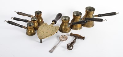 Lot 479 - An antique brass and oak magazine rack,...