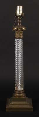 Lot 303 - A brass and glass Corinthian column table lamp