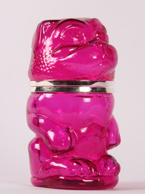 Lot 583 - A pink glass jar, in the form of a dog