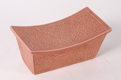 Lot 256 - A Chinese pink carved porcelain pillow