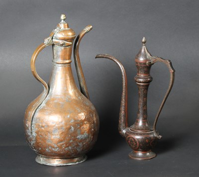 Lot 600 - A Persian style copper coffee pot, together...