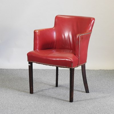 Lot 695 - An early 20th century red leather upholstered desk chair