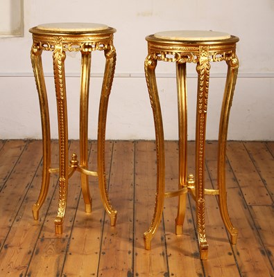 Lot 77 - A pair of carved giltwood stands/tables, each...