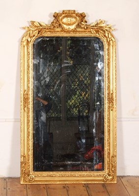 Lot 374 - A large gilt wall mirror, having an ornate...