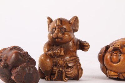 Lot 85 - A Japanese wooden netsuke, in the form of a...