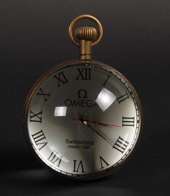 Lot 116 - A glass and brass ball clock/watch