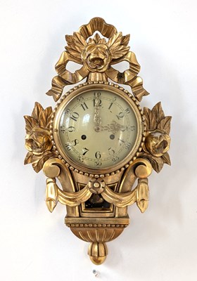 Lot 78 - A carved gilt wood cartel clock, having an...