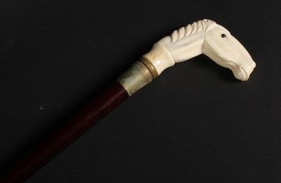 Lot 353 - A bone handled walking stick, the handle in...
