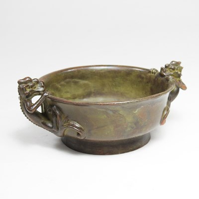 Lot 81 - A Chinese bronze bowl, decorated with dragon...
