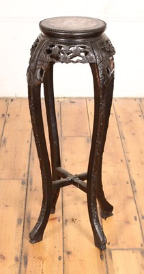 Lot 319 - A Chinese carved hardwood and marble topped...