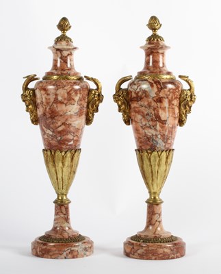 Lot 110 - A pair of continental rouge marble urns, with...