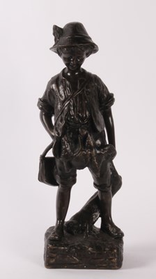 Lot 41 - A bronze figure of a boy, shown standing with...