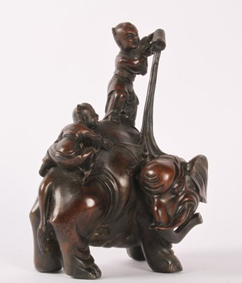 Lot 271 - A Chinese bronze figure group of an elephant...