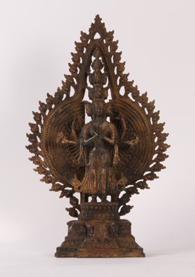 Lot 302 - A Chinese gilt bronze figure of a deity, shown...