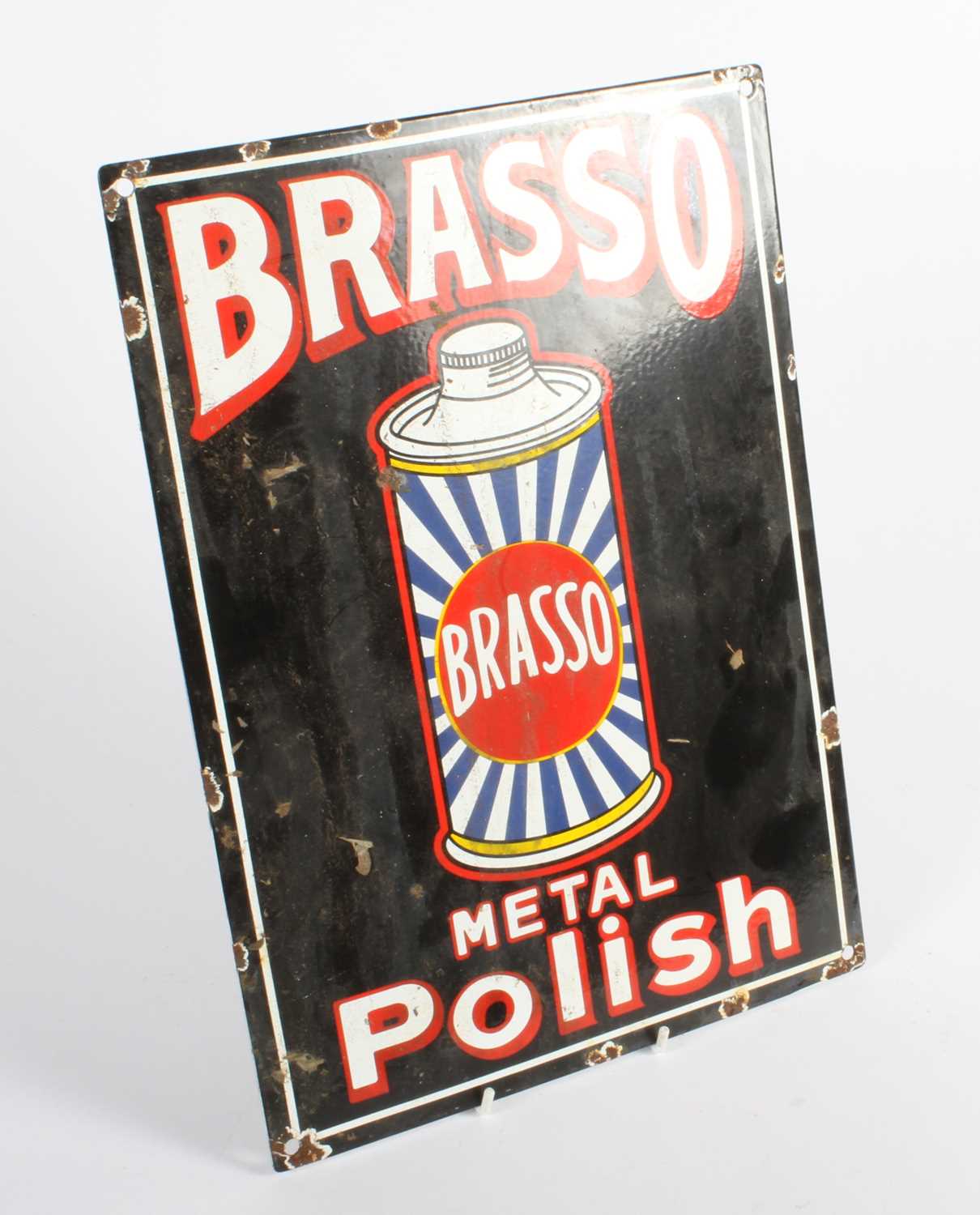 Lot 515 - An enamel on metal sign, inscribed Brasso