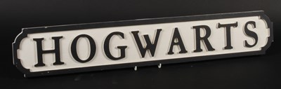 Lot 562 - A wooden Hogwarts sign