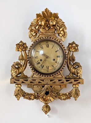 Lot 45 - A carved gilt wood cartel clock, having an...