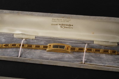 Lot 91 - A Gucci gold plated ladies dress wristwatch,...