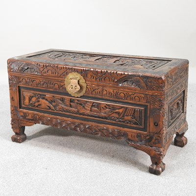 Lot 89 - An Eastern carved camphor coffer, with a...