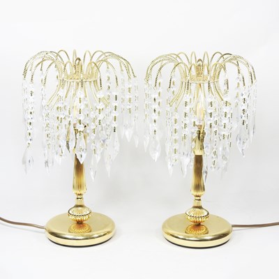 Lot 202 - A pair of decorative gilt table lamps, with...