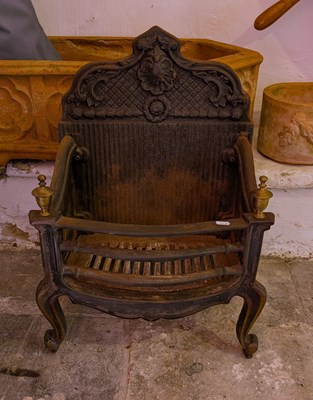 Lot 655 - An antique cast iron fire grate, with a shaped...