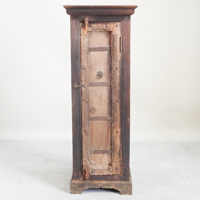 Lot 434 - An eastern hardwood narrow cabinet, enclosed...