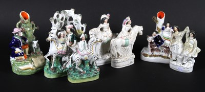 Lot 390 - A 19th century Staffordshire flatback spill...