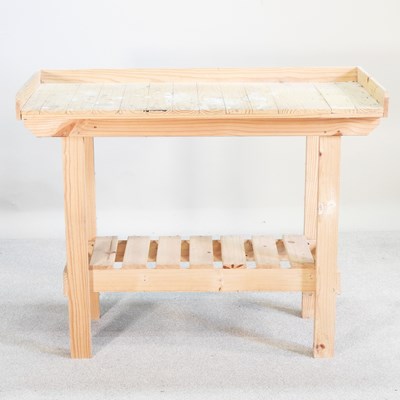 Lot 173 - A pine potting table, with a shelf below
