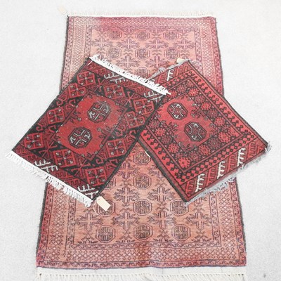 Lot 493 - A Bokhara rug, on red ground, 146 x 87cm,...