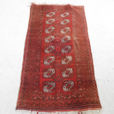 Lot 196 - A Bokhara rug, on red ground, 164 x 84cm